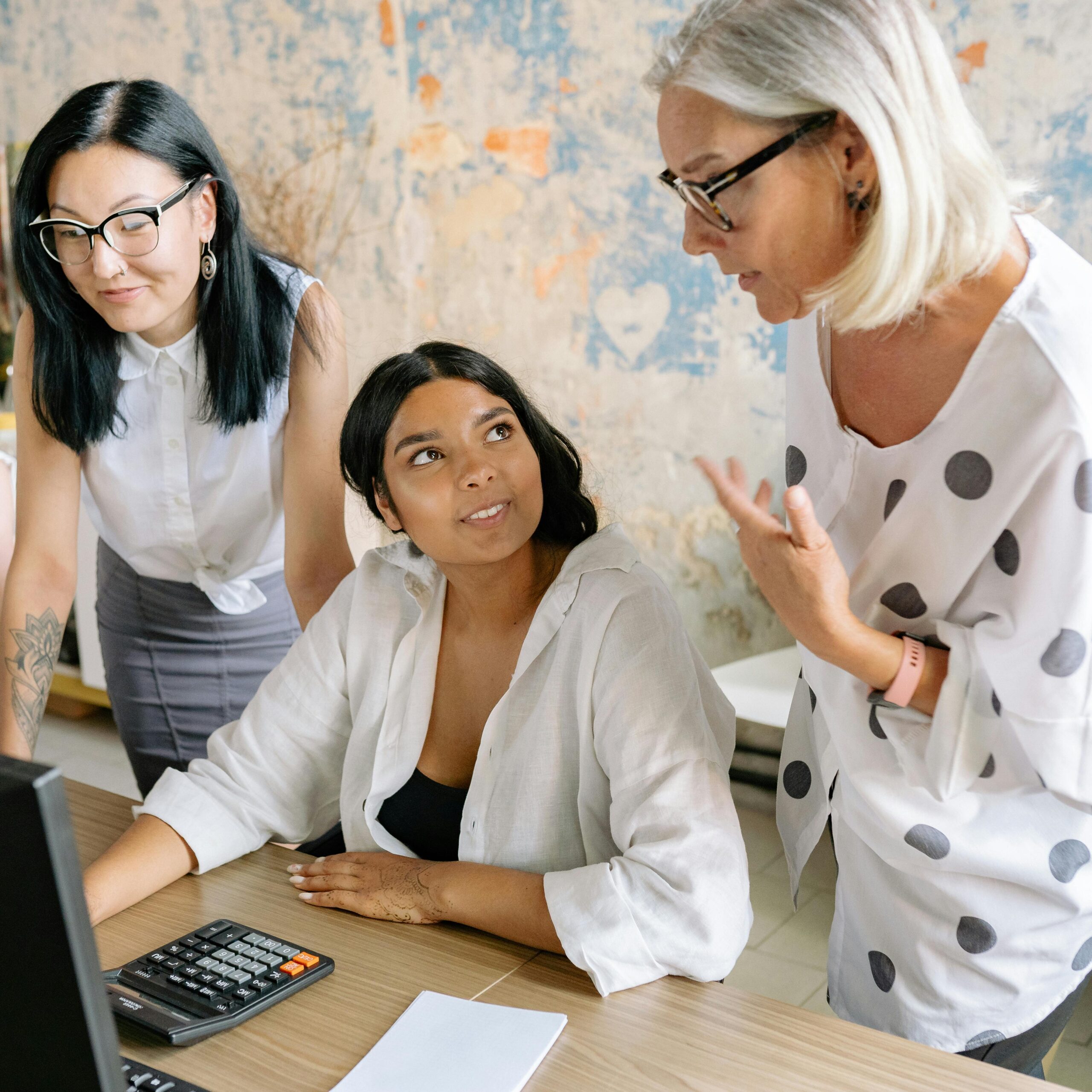 women collaborating in front of a computer